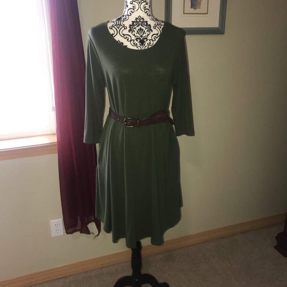 Green T-shirt dress with pockets.